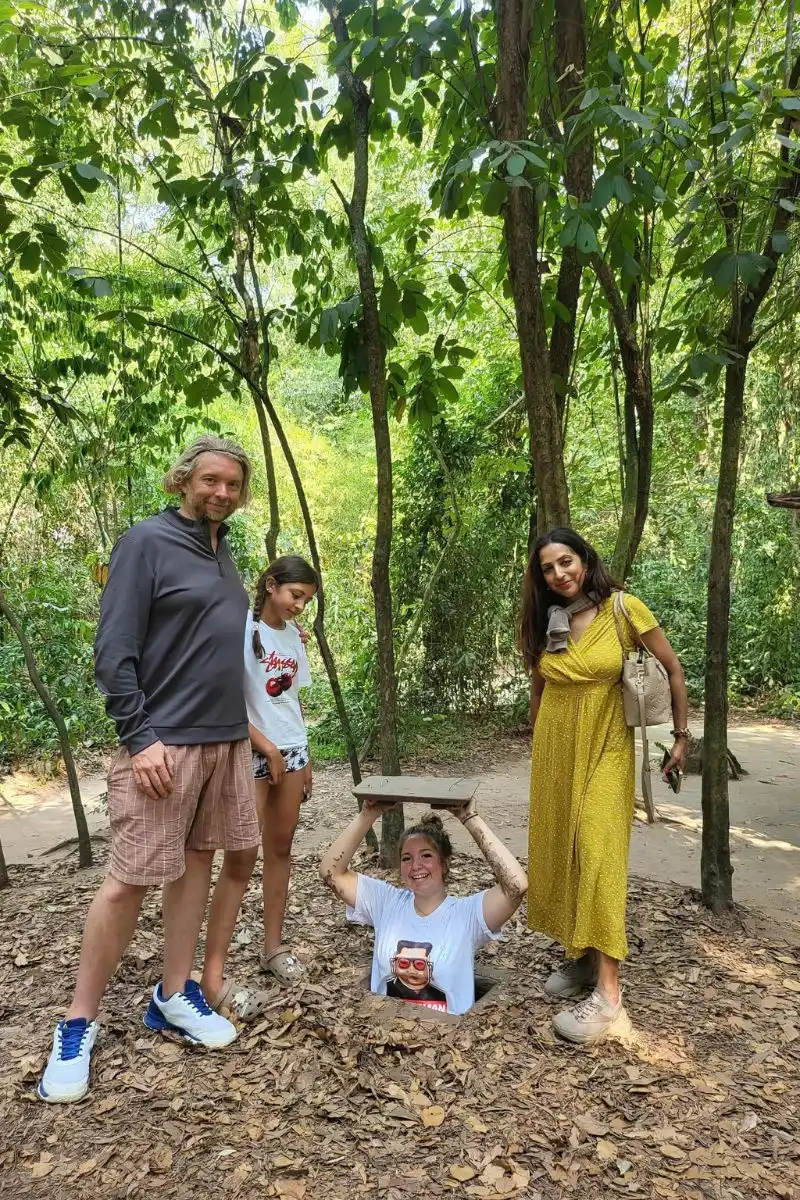 Foreign travelers discovering Vietnam's hidden history through a guided forest heritage tour