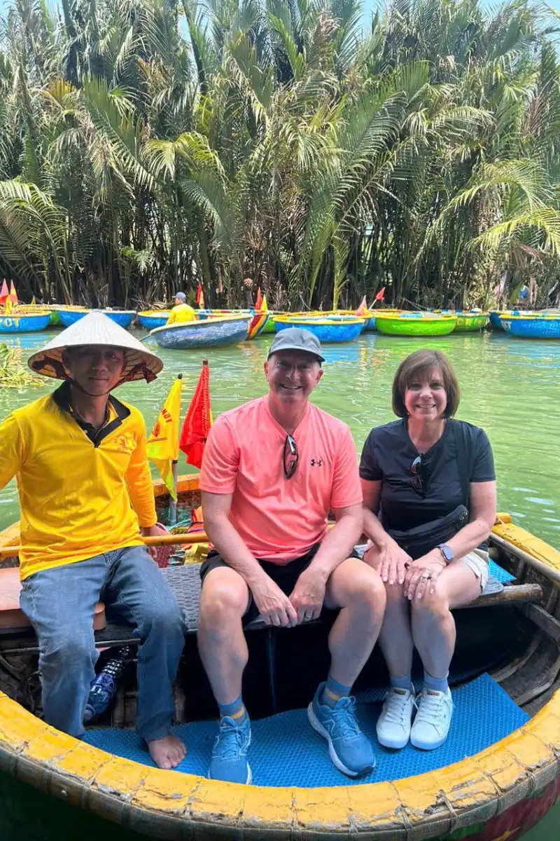 International tourists enjoying a sustainable basket boat excursion led by local fishermen in Hoi An