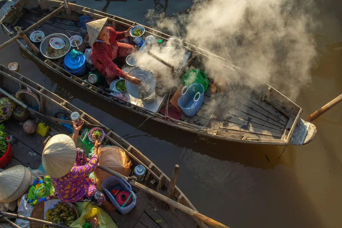 Luxury Southeast Asia tours featuring a serene Mekong River sunset in Laos