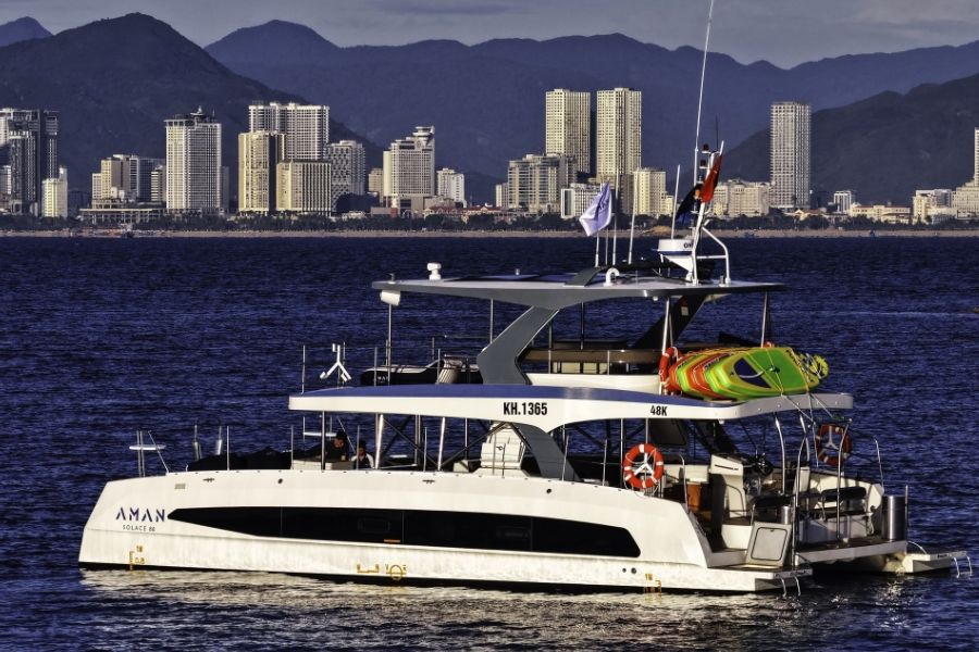 Modern yacht cruising along Nha Trang coastline on a luxury Vietnam tour