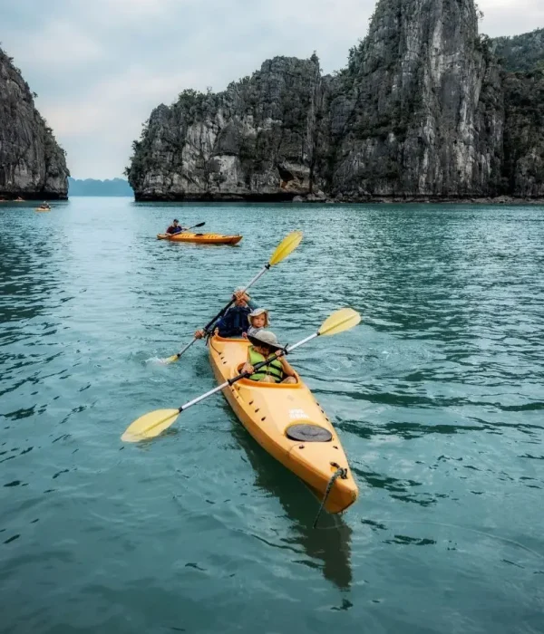 family kayaking in halong bay