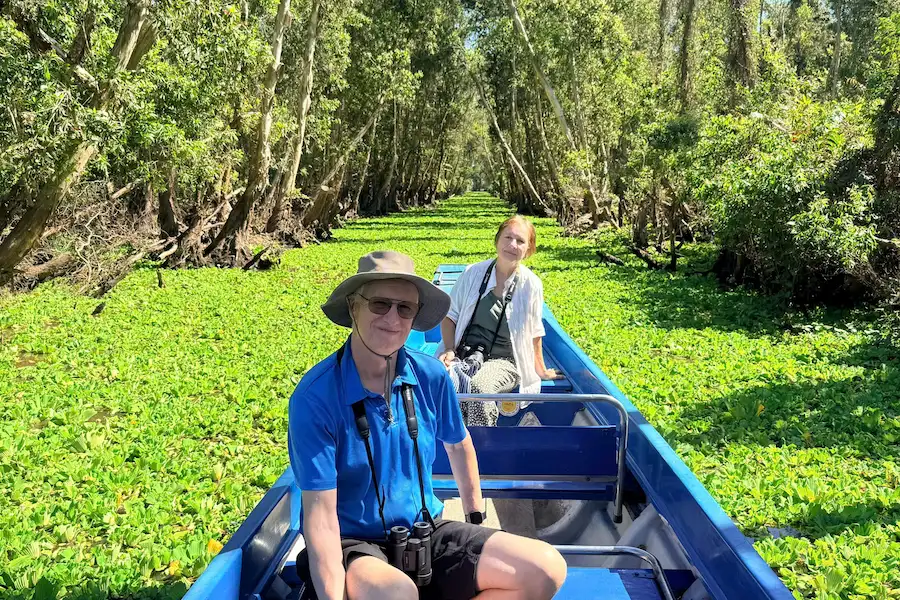 happy customers enjoying a private boat ride in tra su cajuput forest