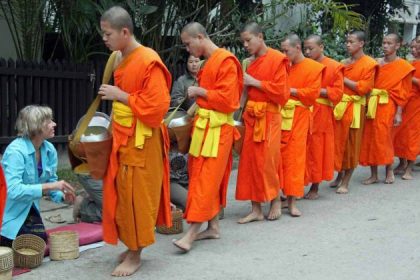 morning alms giving in laos