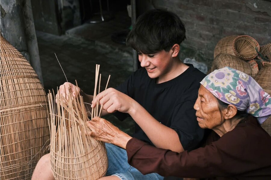try to make bamboo fish trap in luxury vietnam tours